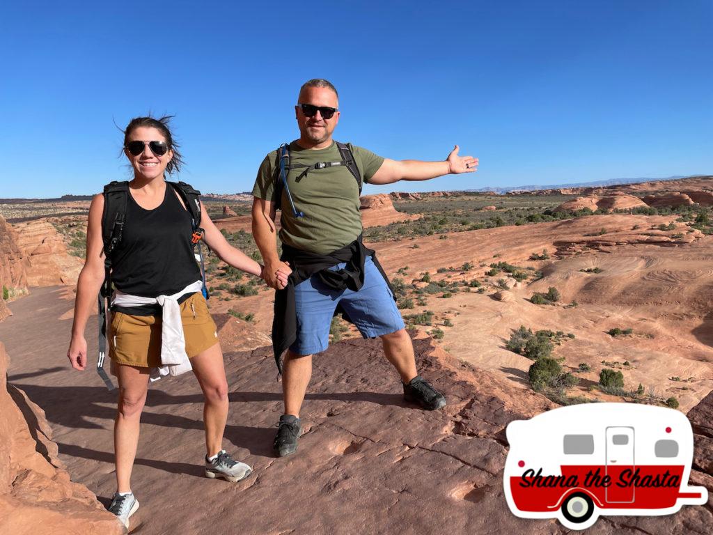102-Brave-Couple-on-the-Cliffs-near-Delicate-Arch