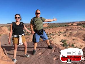 102-Brave-Couple-on-the-Cliffs-near-Delicate-Arch