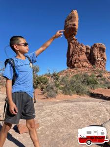 144-Boy-Holding-up-Balanced-Rock