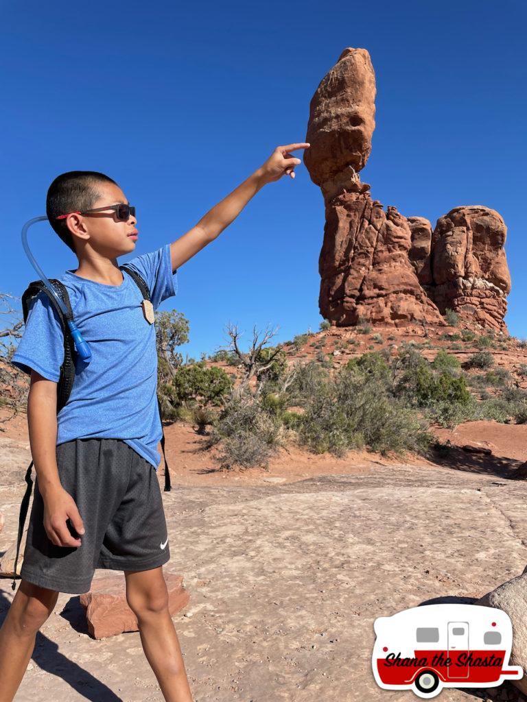 144-Boy-Holding-up-Balanced-Rock