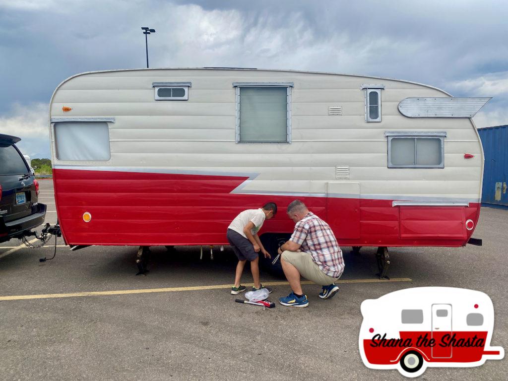 16-Father-Son-Fix-a-Flat-Camper-in-Colorado