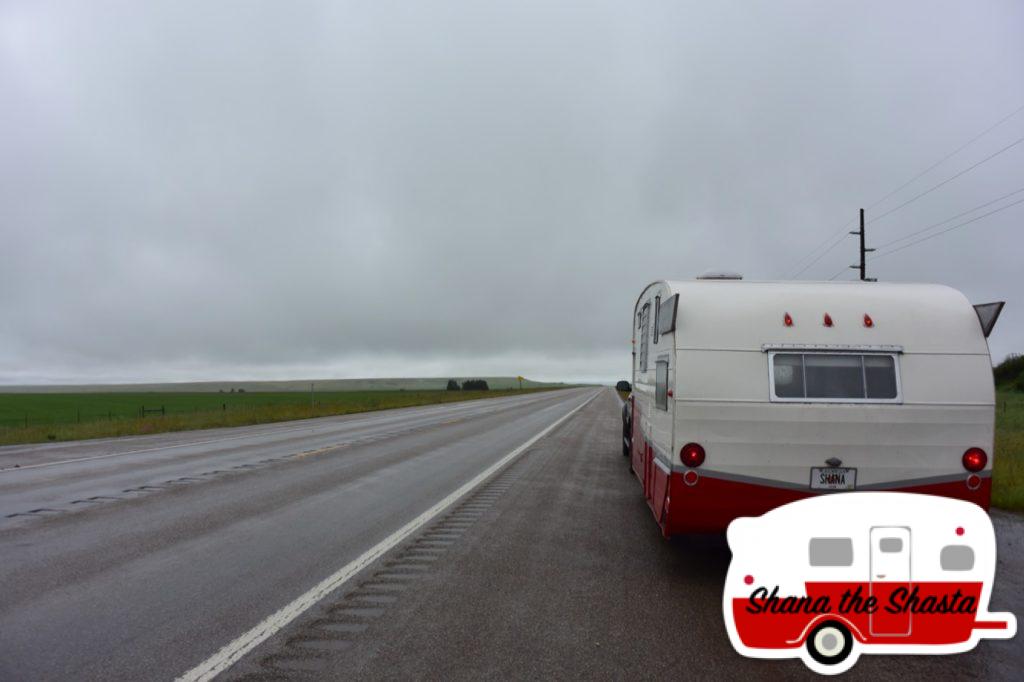 Retro-Camper-on-Rainy-Road-Montana