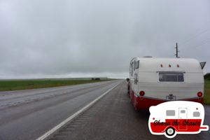 Retro-Camper-on-Rainy-Road-Montana
